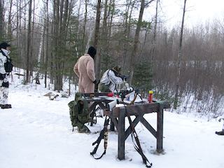 Militia members in a forest with snow