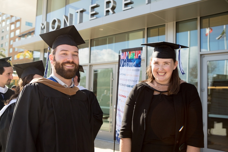 Two MBA graduates outside Monterey Conference Center
