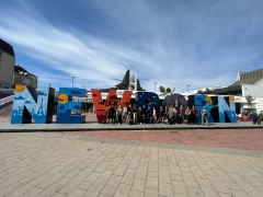 students posing with the Newborn sign in Pristina, Kosovo on a recent spring break trip